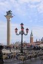 Italy. Venice. Pink street lamp. Murano glass and The Saint Marco coloumn with lion